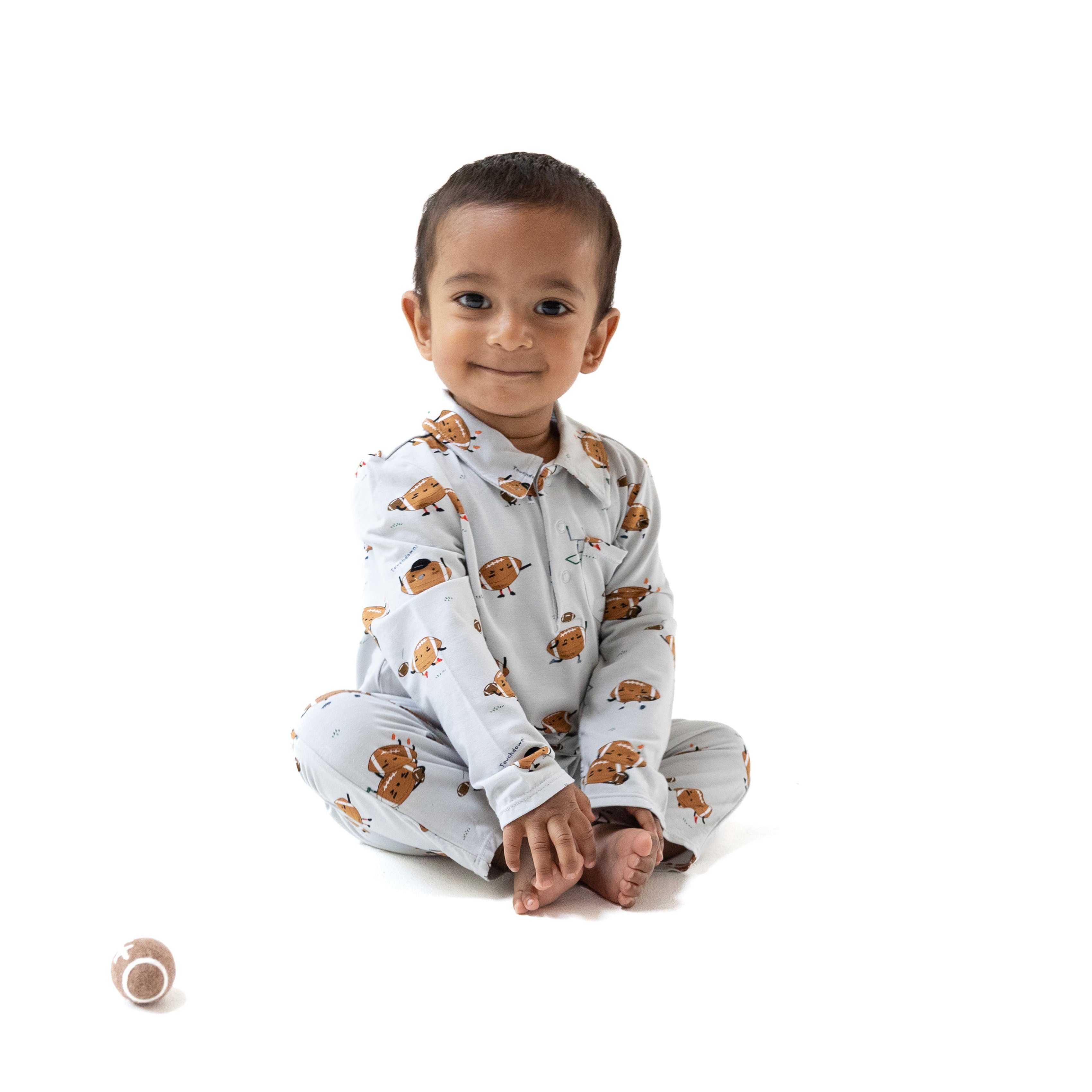 Polo Romper in our  Footballs Playing Football print from Angel Dear