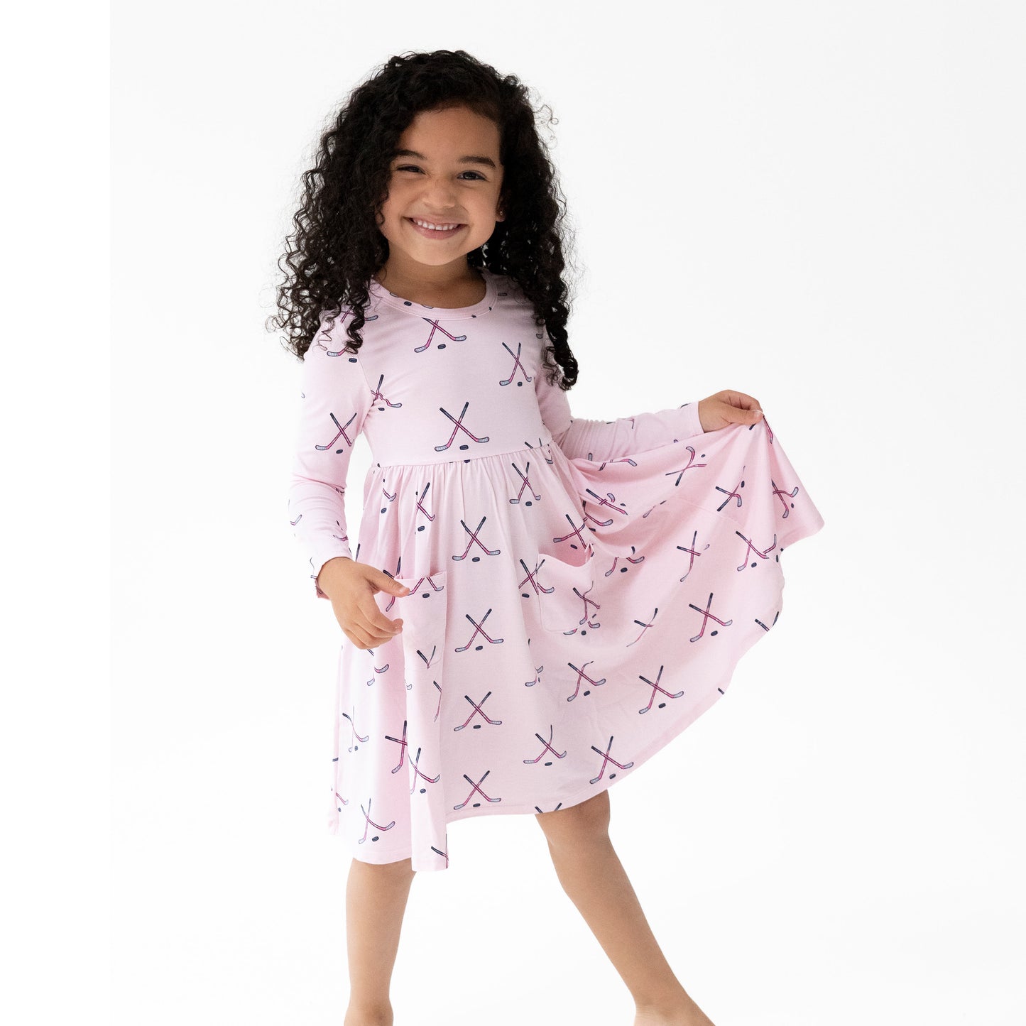 Twirly Long Sleeve Dress in our  Hockey - Pink print from Angel Dear