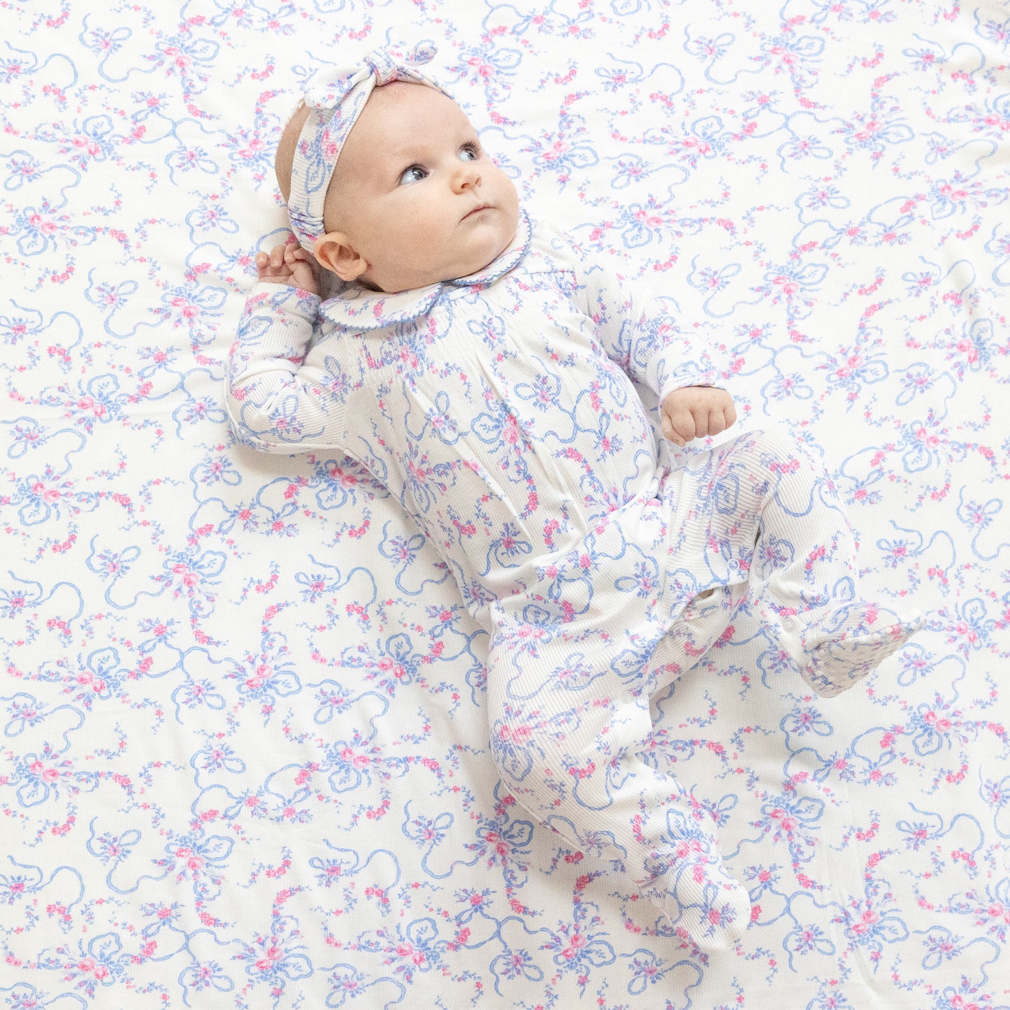 Smocked Peter Pan Snap Footie in our  Ribbon Floral Fling print from Angel Dear