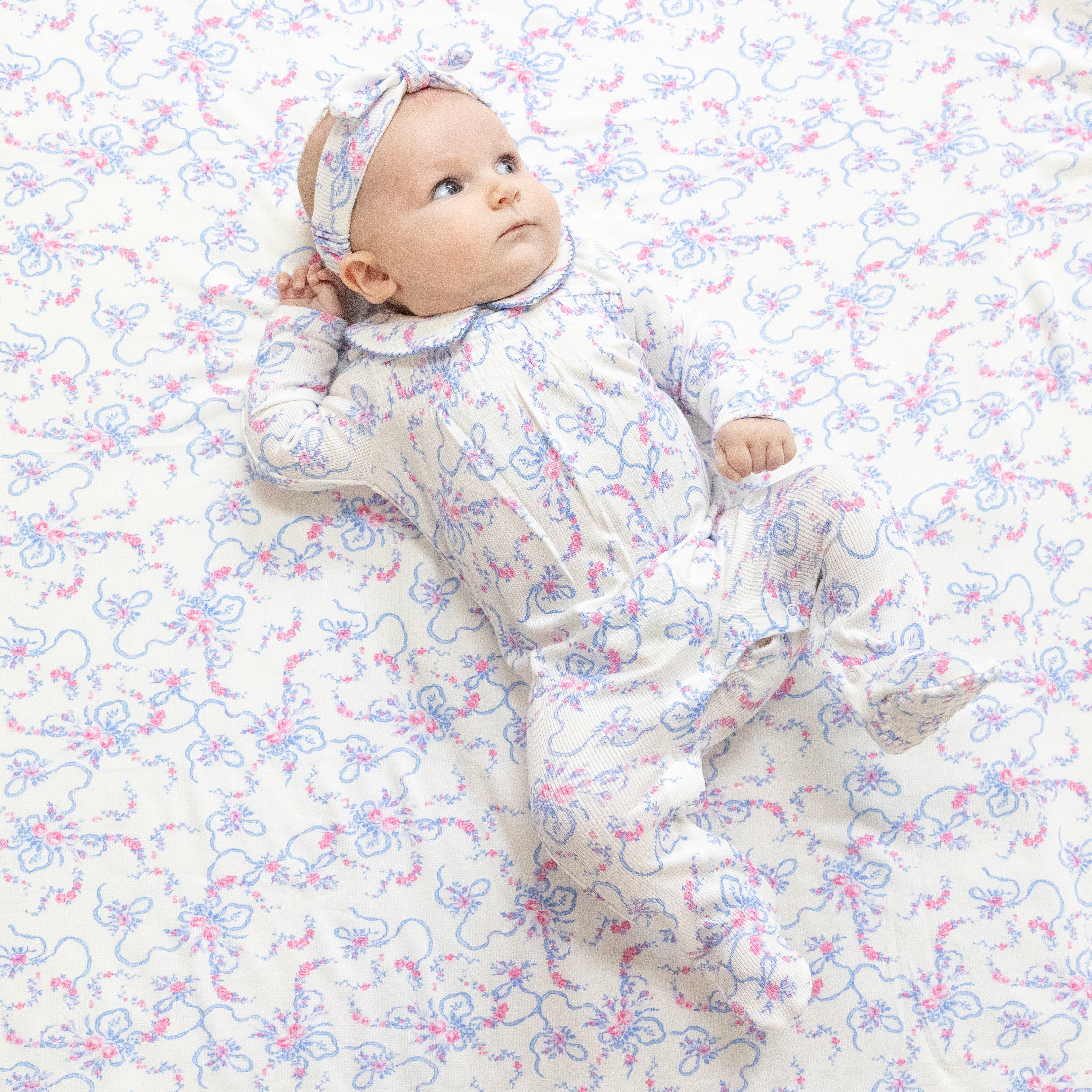 Smocked Peter Pan Snap Footie in our  Ribbon Floral Fling print from Angel Dear