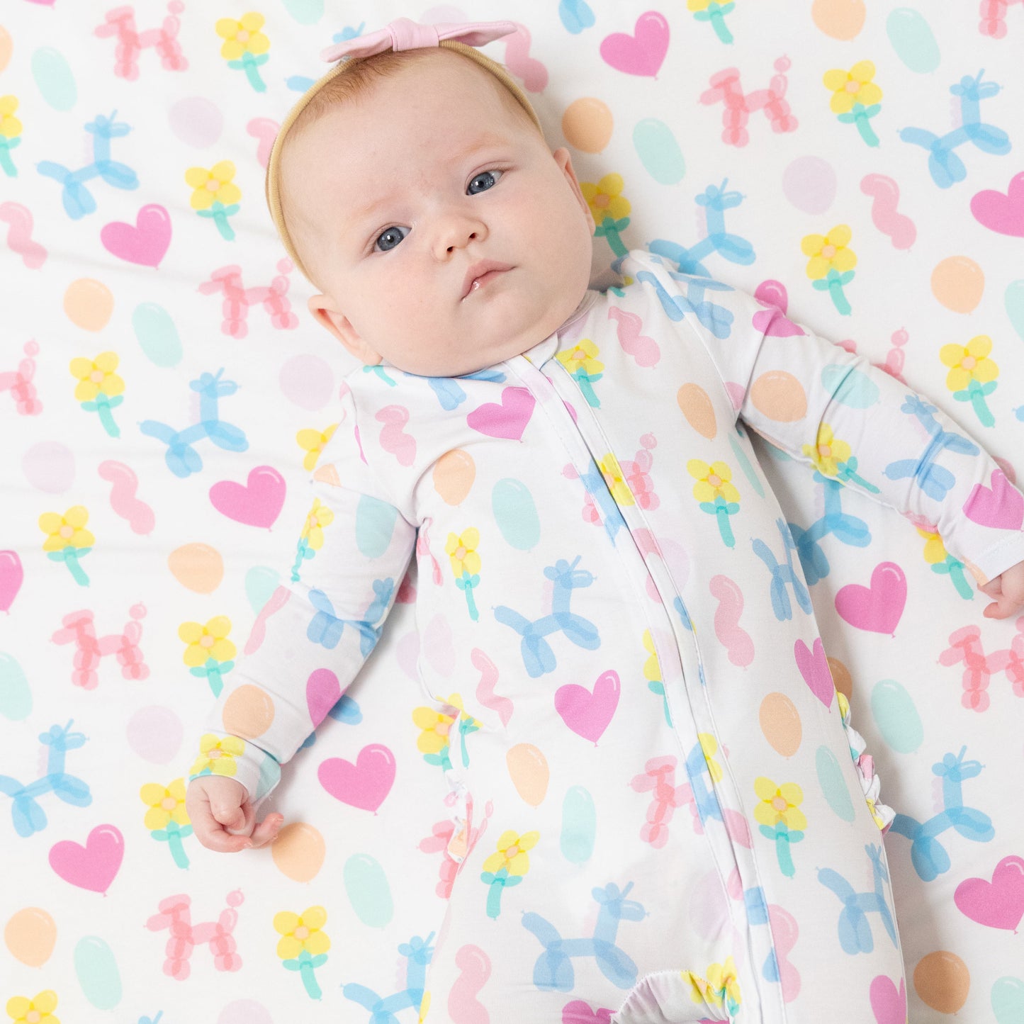 2 Way Zipper Ruffle Back Footie in our  Balloon Animals Pink print from Angel Dear