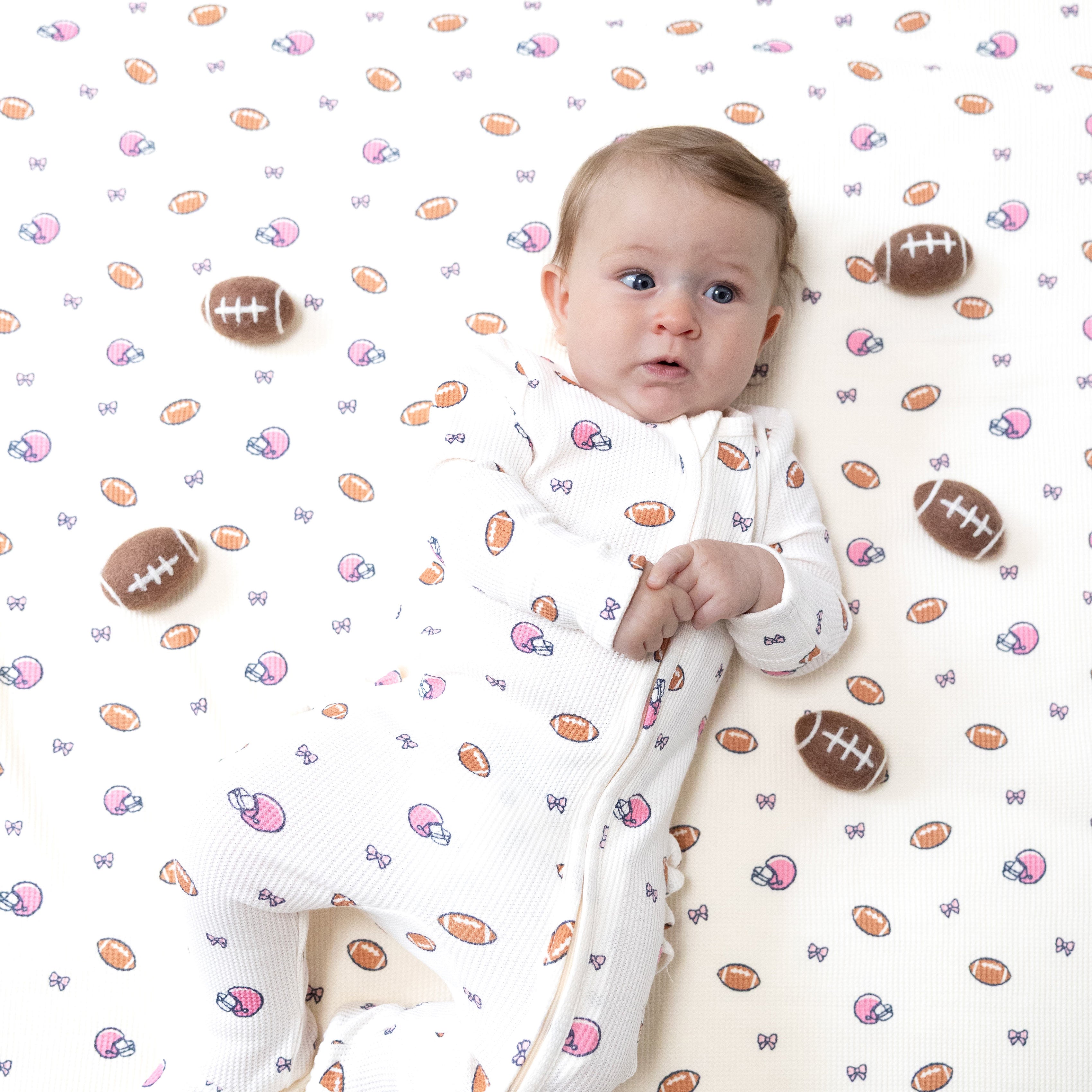 2 Way Zipper Ruffle Back Footie in our  Footballs and Bows print from Angel Dear