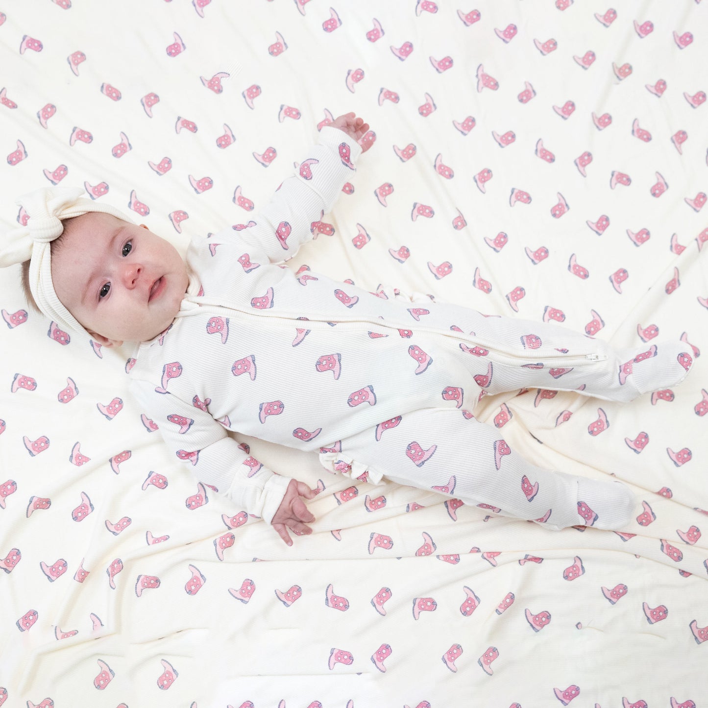 2 Way Zipper Ruffle Back Footie in our  Petite Cowgirl Boots print from Angel Dear