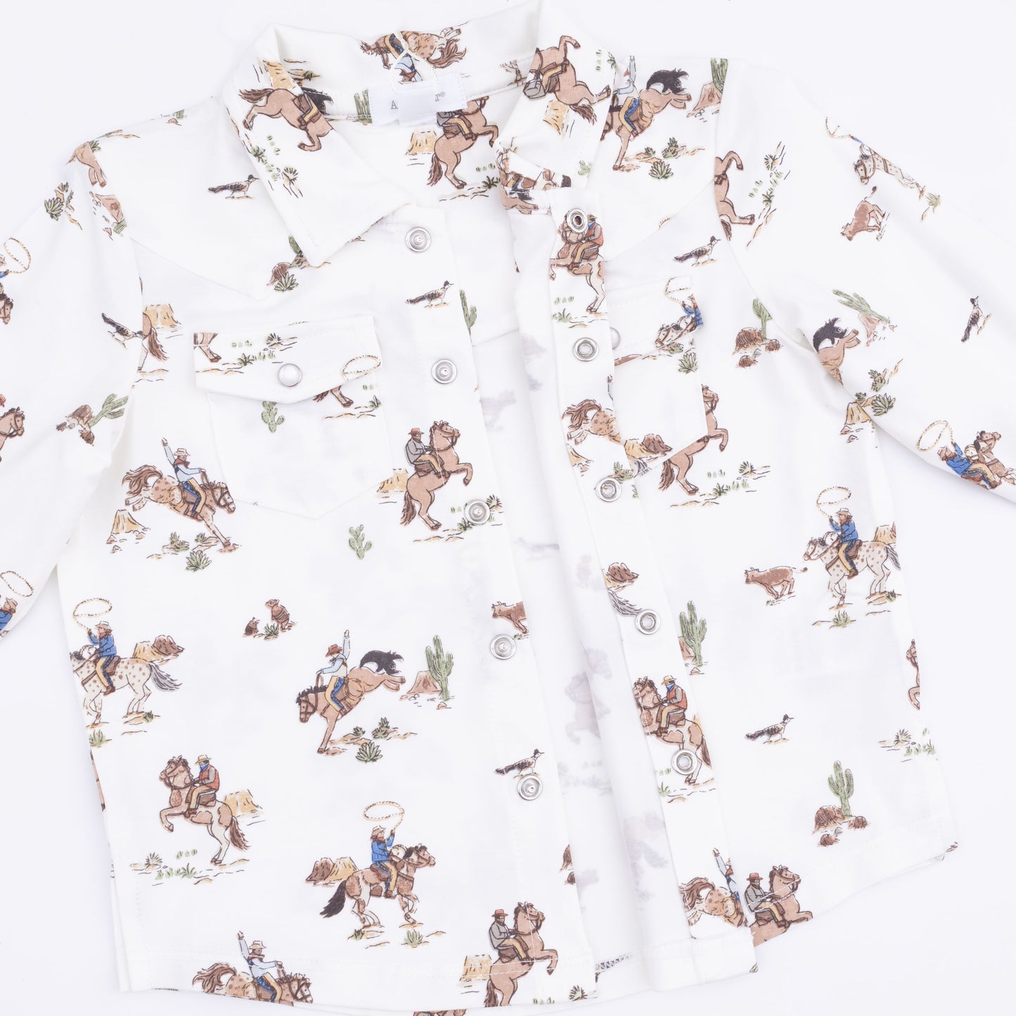 Floral patterned fabric with horse and rider design on a white background