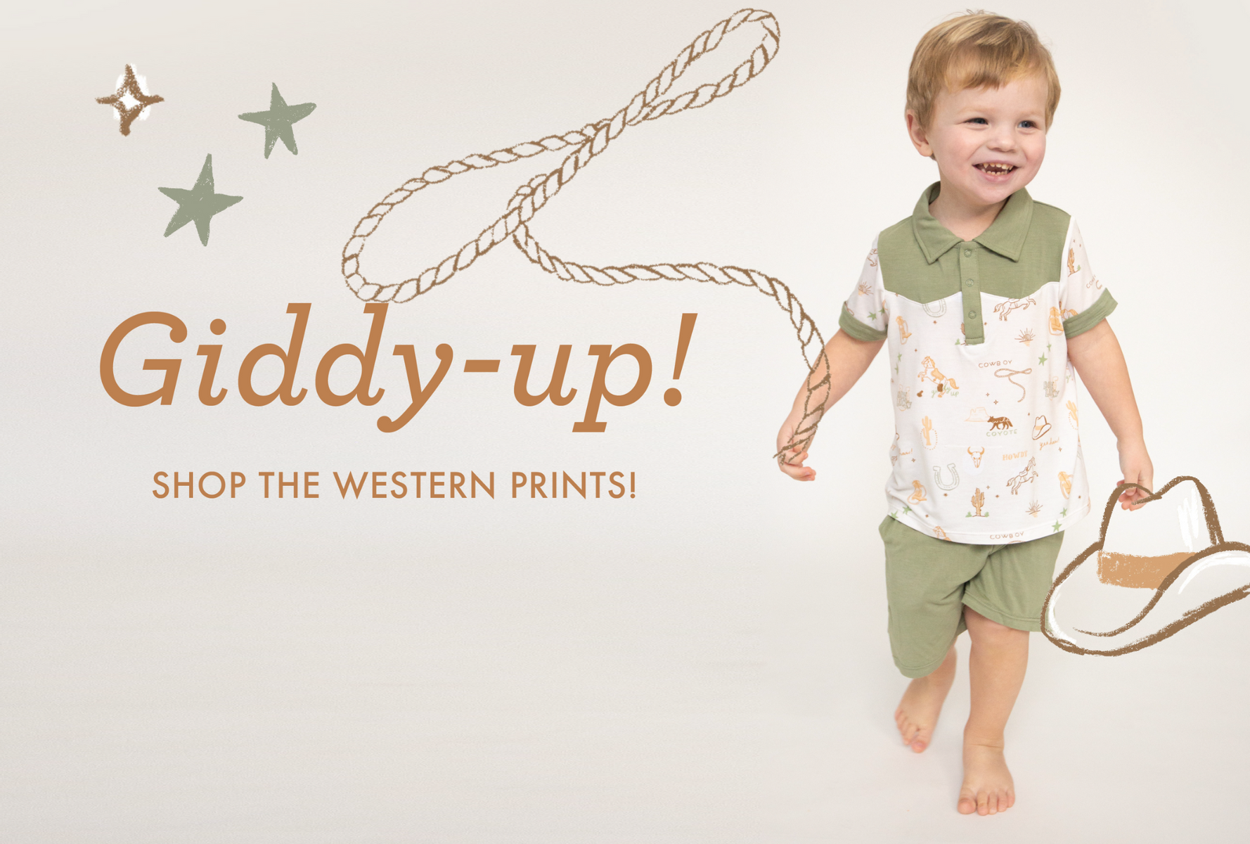 Baby boy smiling in a western print outfit