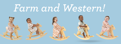 Children ride wooden rocking horses wearing western print themed clothes.