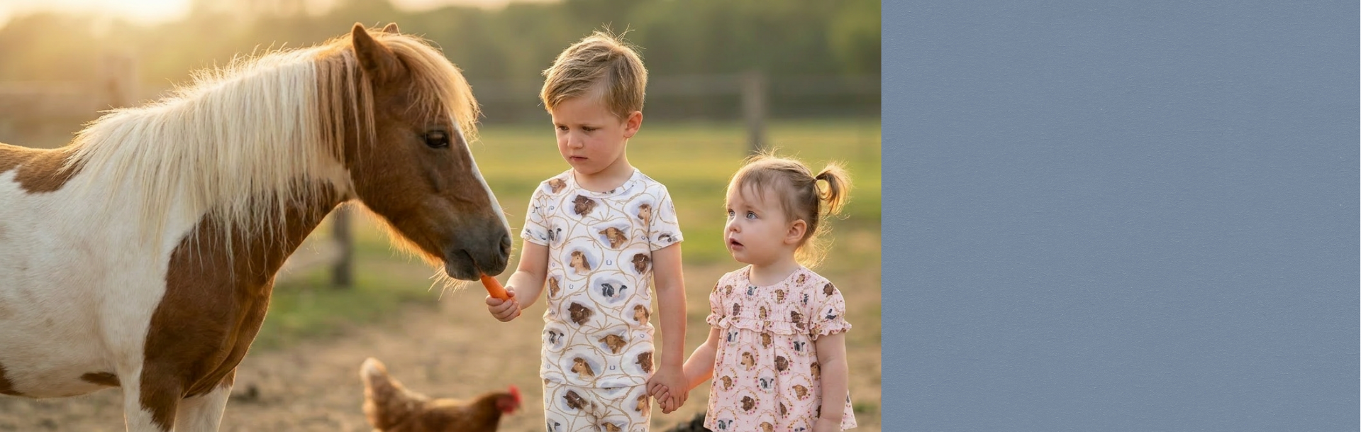 Two children wear farm animal printed outfits styles (boy in pajamas and girl in dress) while feeding a small horse. Background is a farm with chickens. 