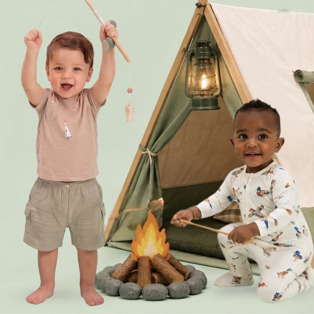 Two children playing around a campfire in front of a small tent wearing camping themed outfits.